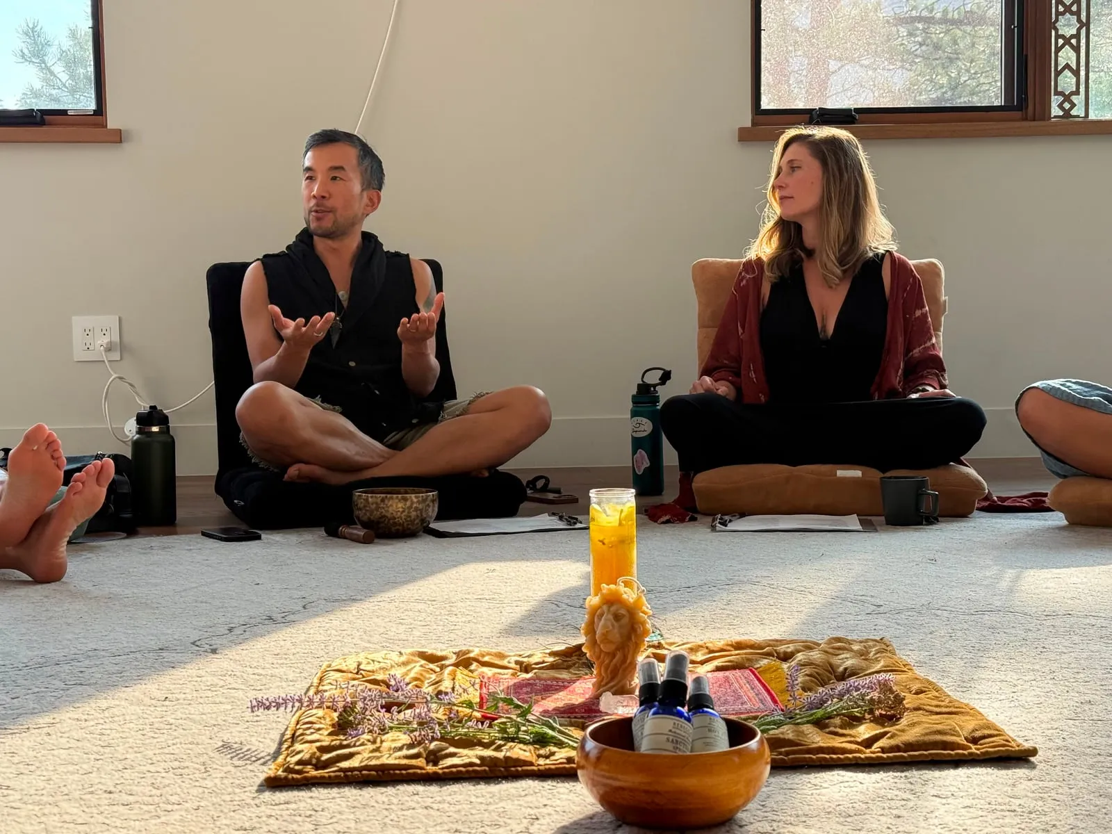 Edmond and Kiki teaching the True Contact cohort, seated beside the altar