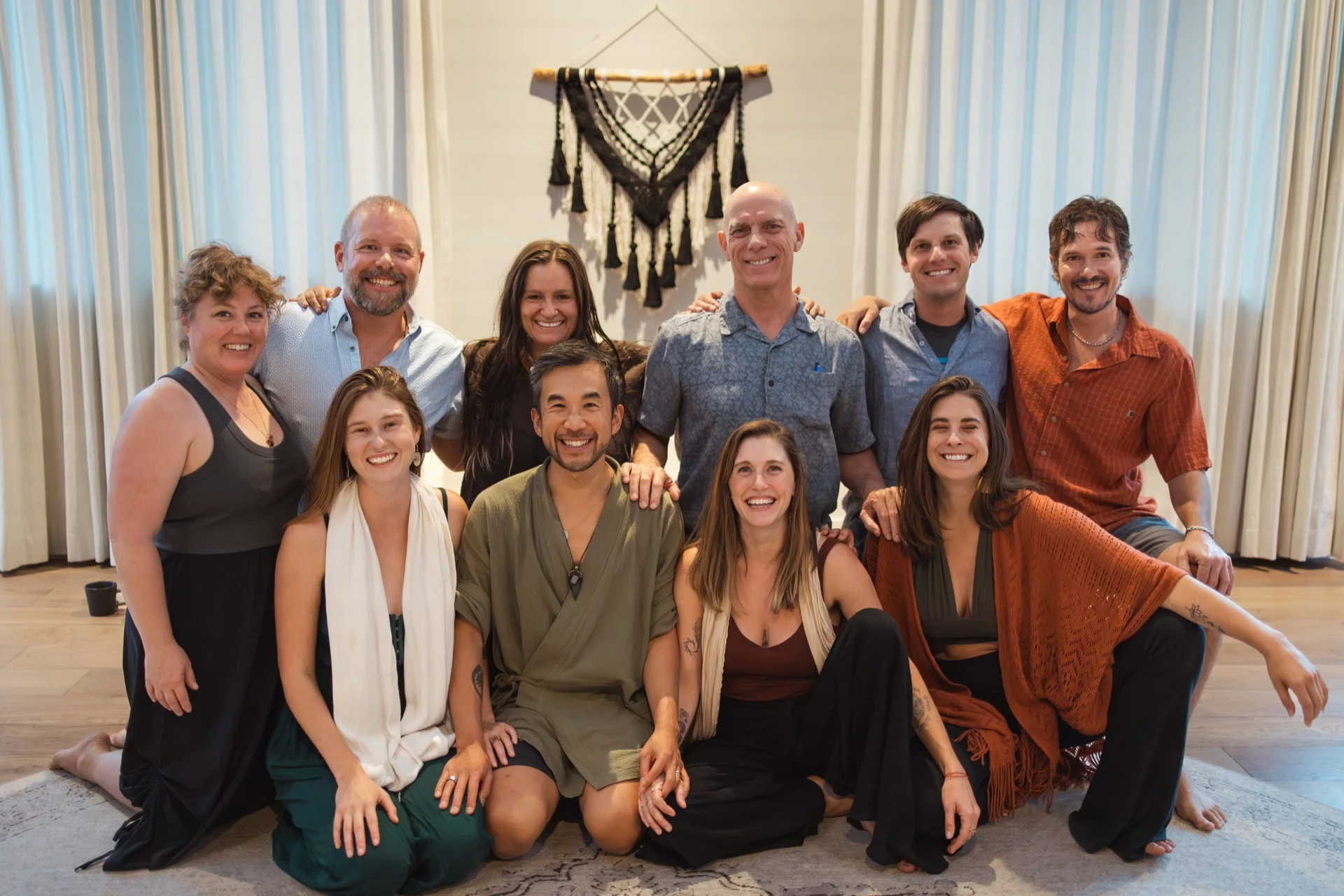 The founding cohort together at the end of the four weeks, arms around each other